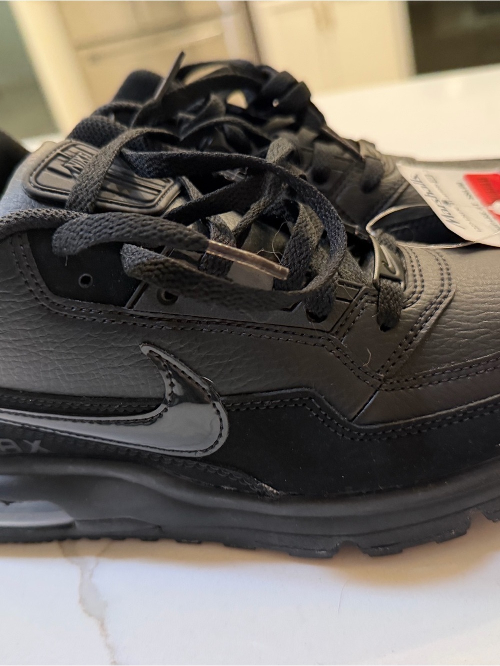 Nike Men’s Black Low-Top Leather Sneakers